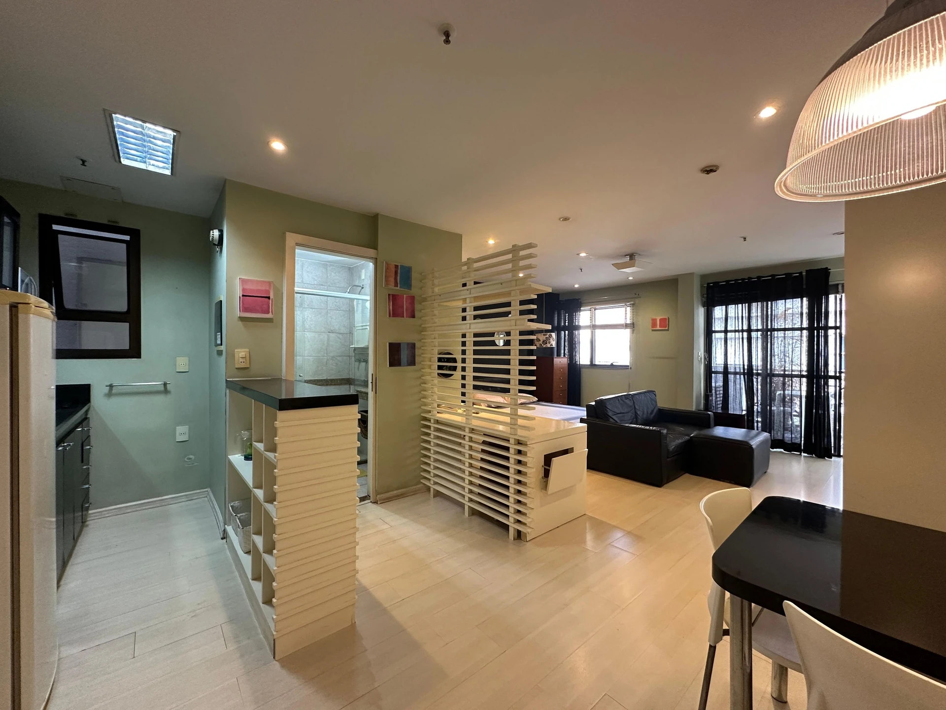 Furnished studio with open-plan kitchen and balcony