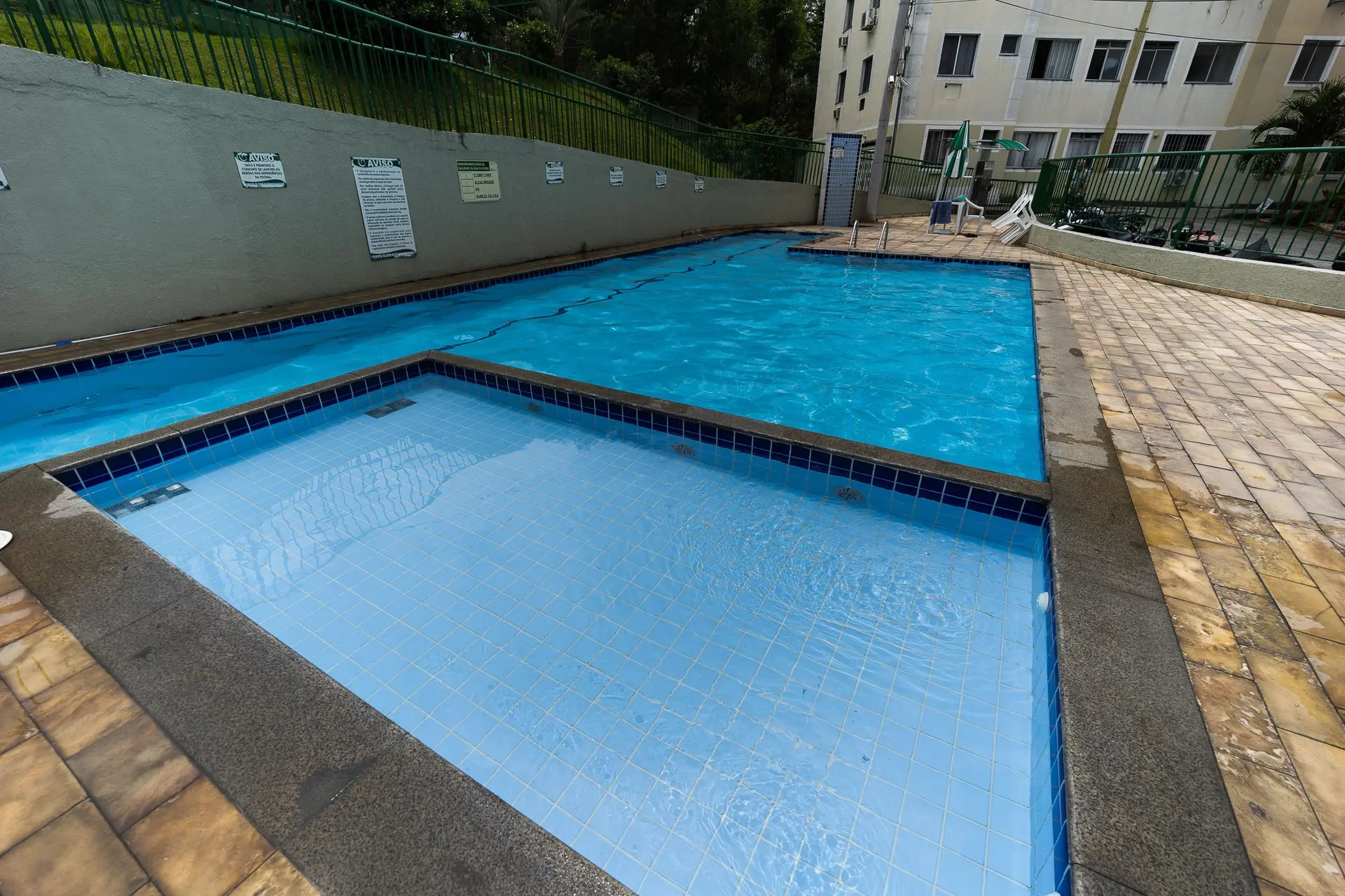 2-bedroom apartment in a building with a pool — photo 14