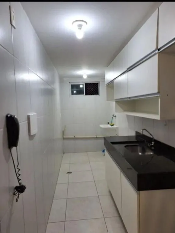Apartamento de 60 m² com 2 quartos e cozinha separada