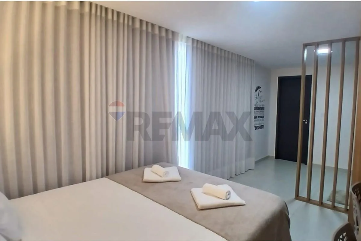 One-bedroom apartment in a building with a pool — photo 12