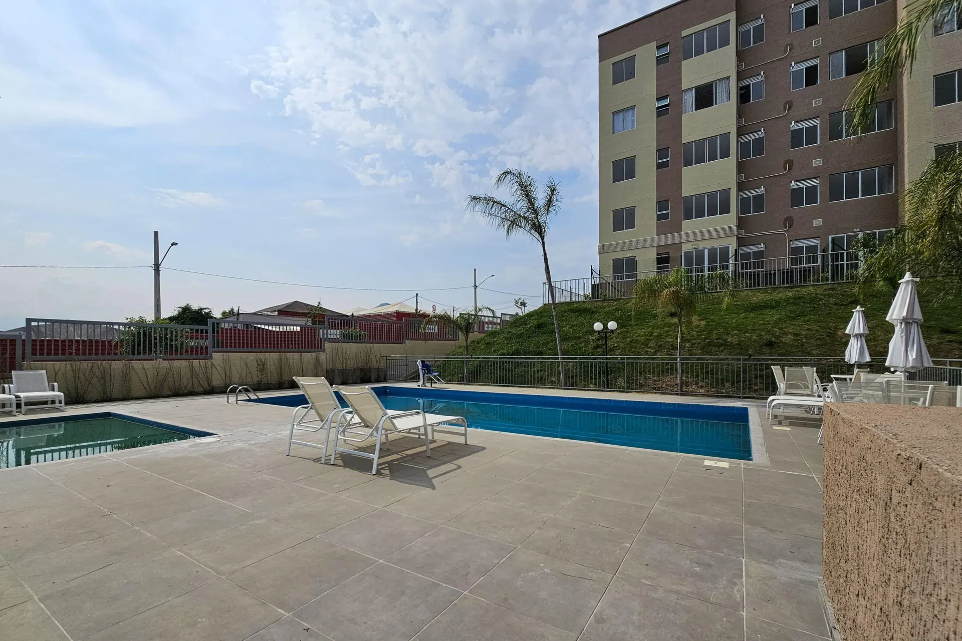 2-bedroom apartment in a building with a pool — photo 11