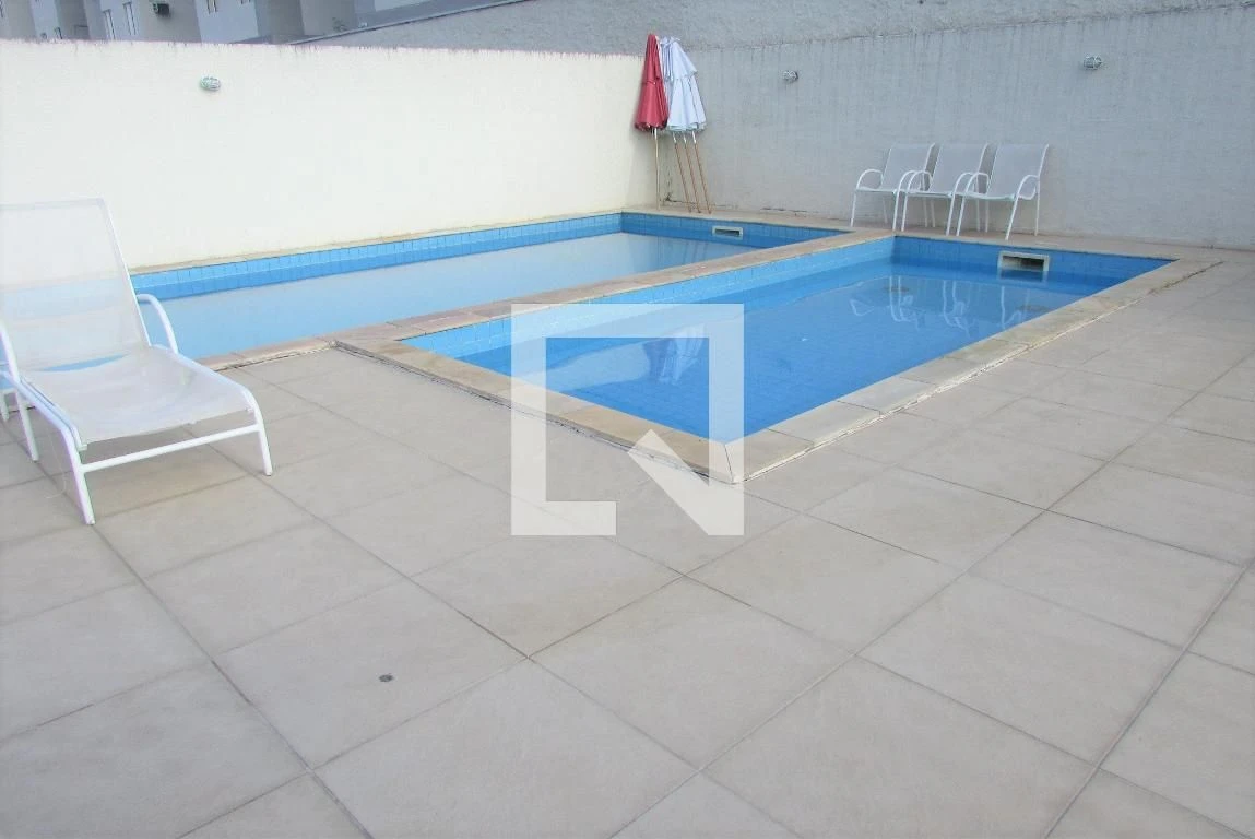 2-bedroom apartment in a building with a pool — photo 12