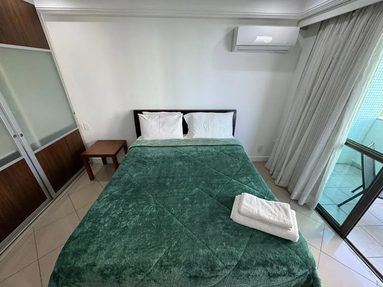 1-bedroom apartment with glass shower and electric showerhead — photo 14